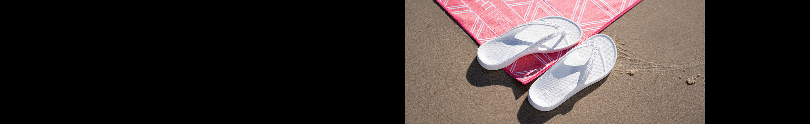Female wearing Denim Lightfeet Arch Support Thongs on sand