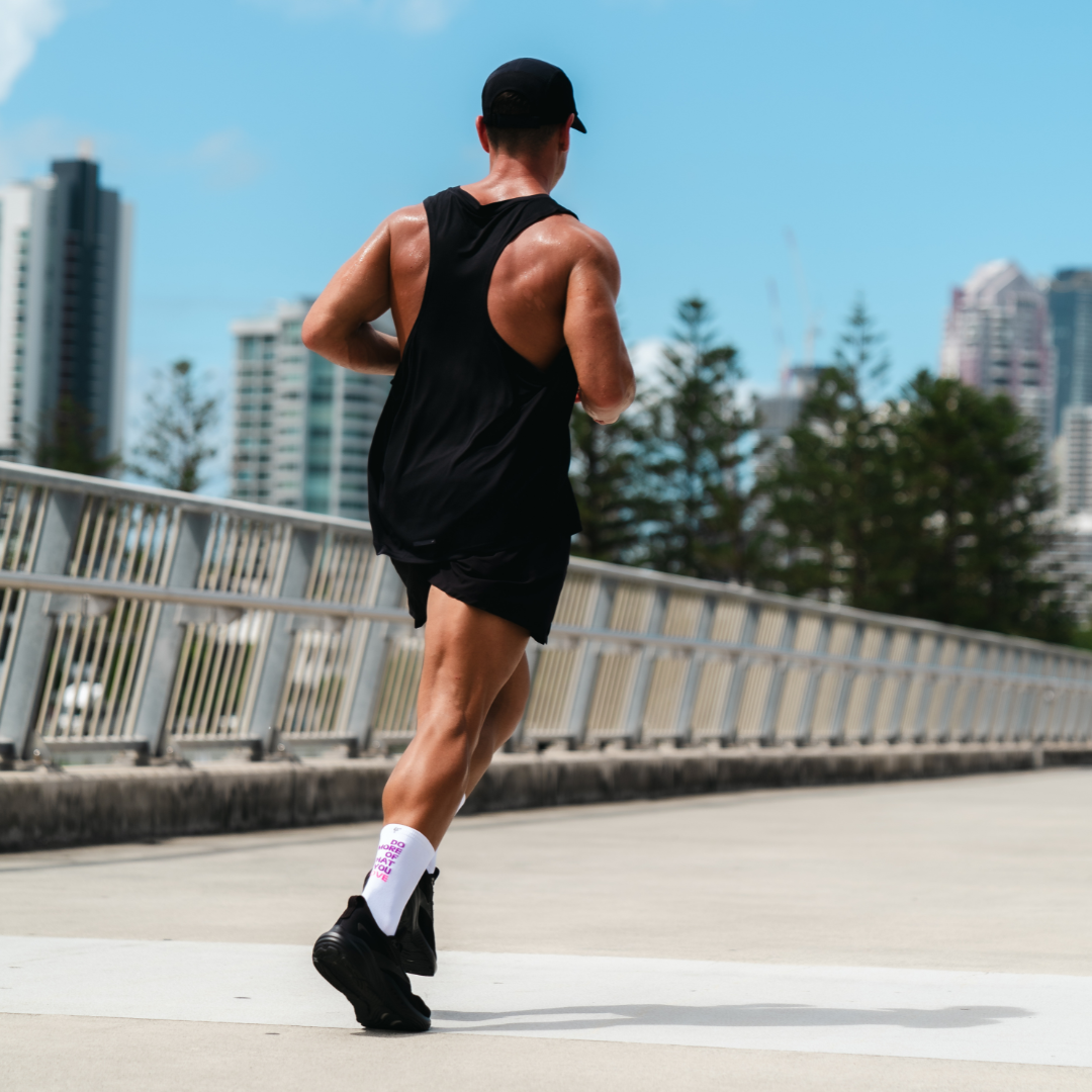 Image of person wearing Lightfeet Performance Do More Of What You Love White Purple Pink Crew Socks