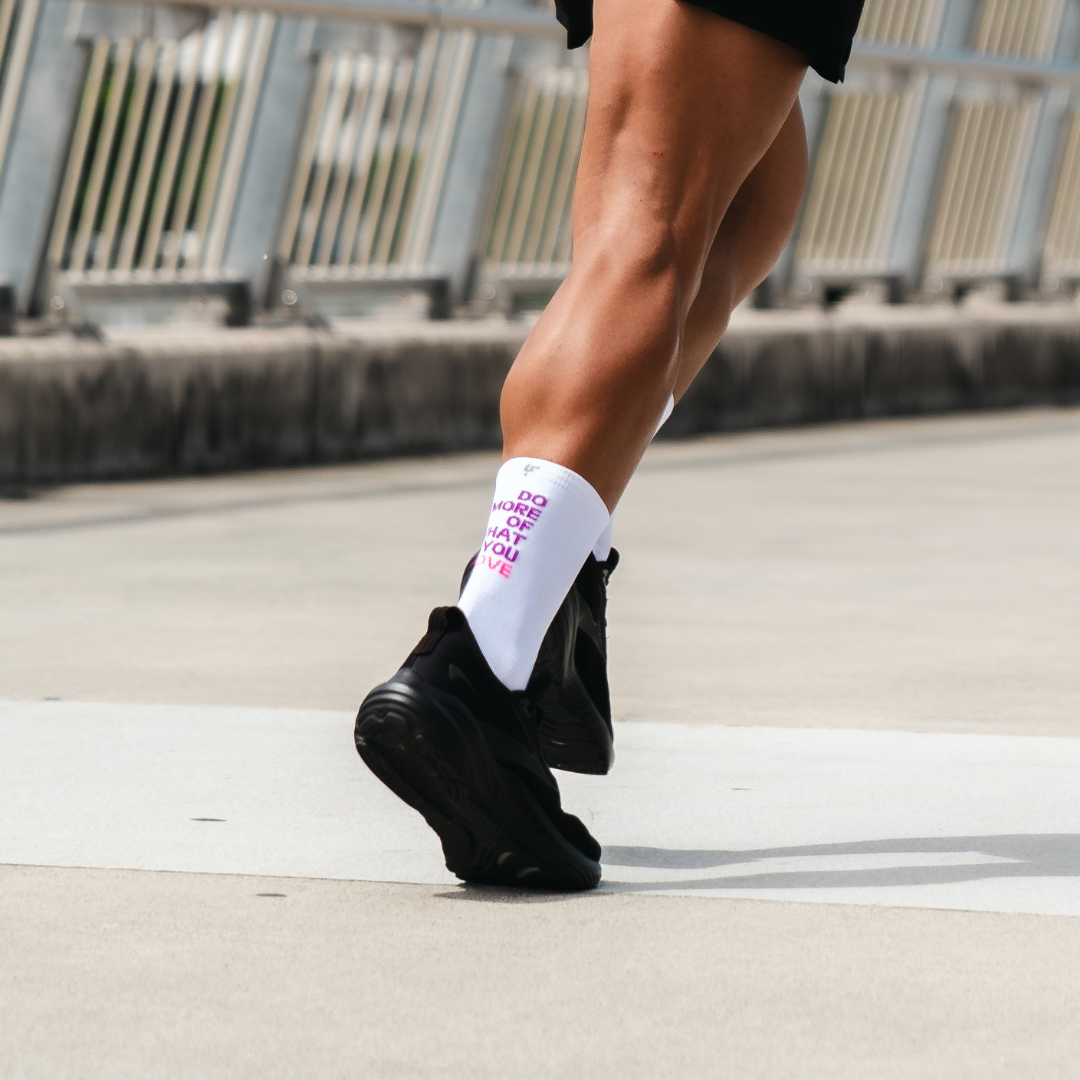 Image of person wearing Lightfeet Performance Do More Of What You Love White Purple Pink Crew Socks