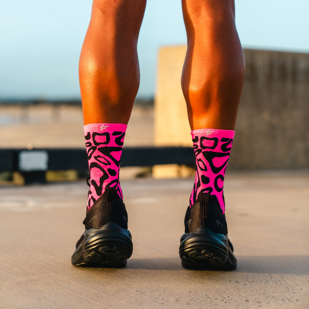 Image of person wearing Lightfeet Performance Scribbles Pink Black Crew Socks