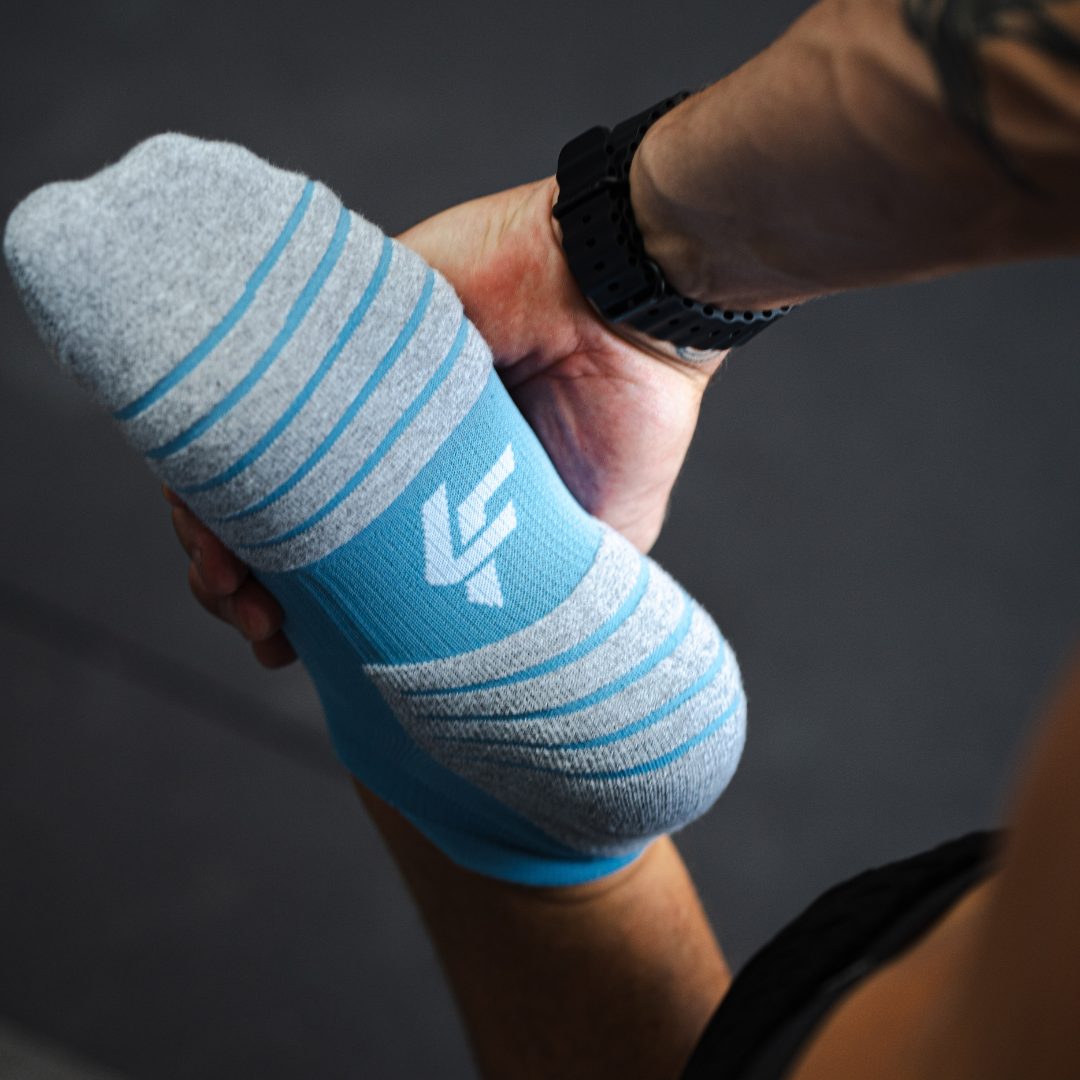 Person wearing Lightfeet Performance Soft Blue Ankle Sock