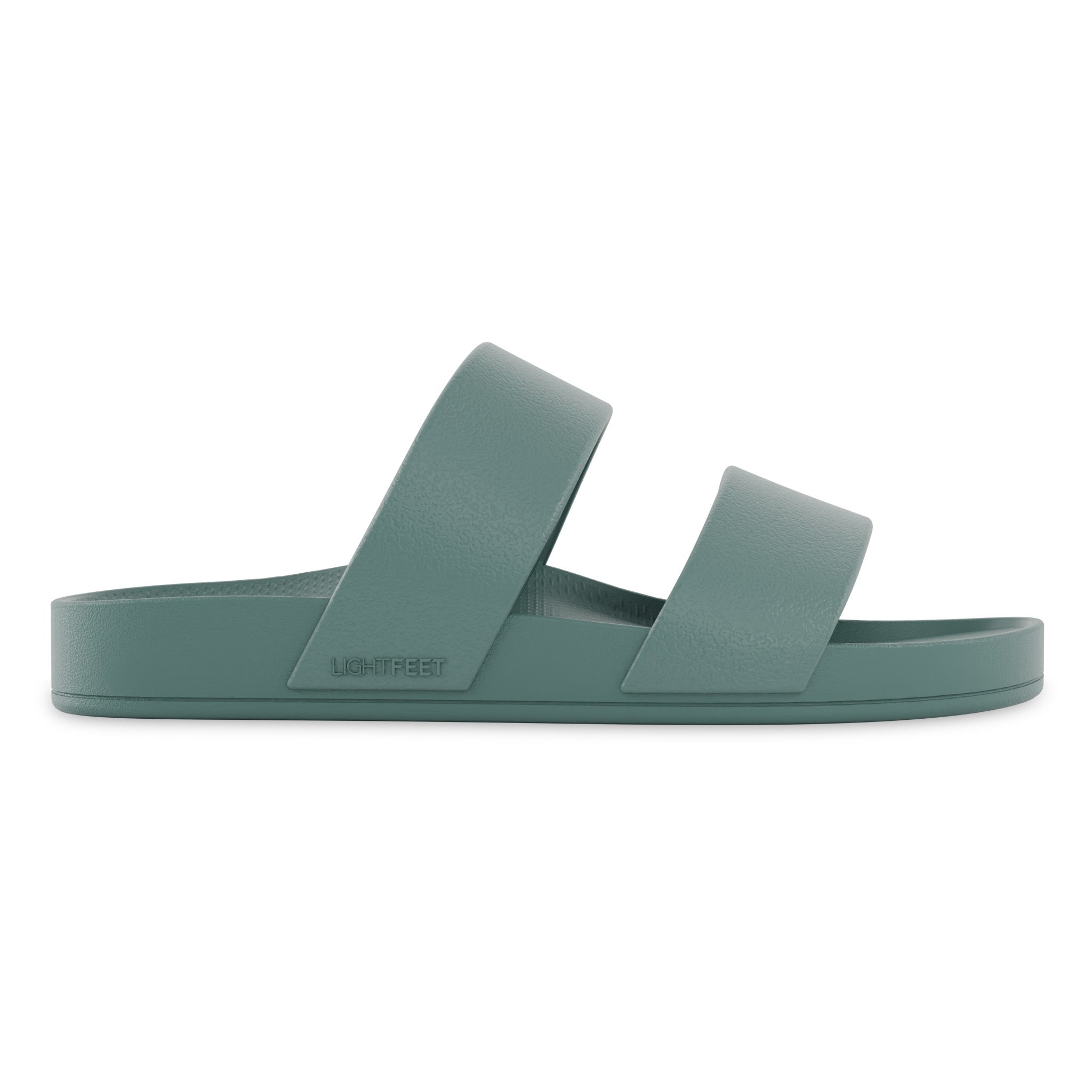 Green sandal with two straps on a white background