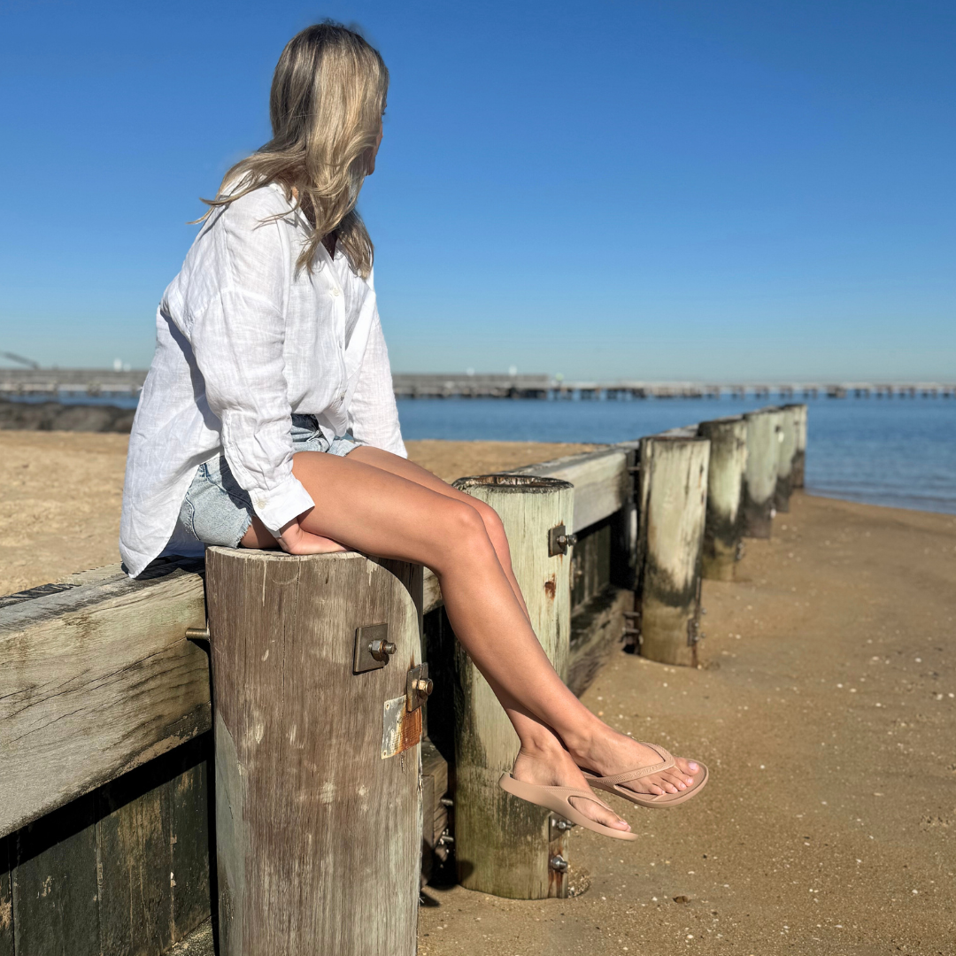 Person wearing Latte Lightfeet Arch Support Thongs