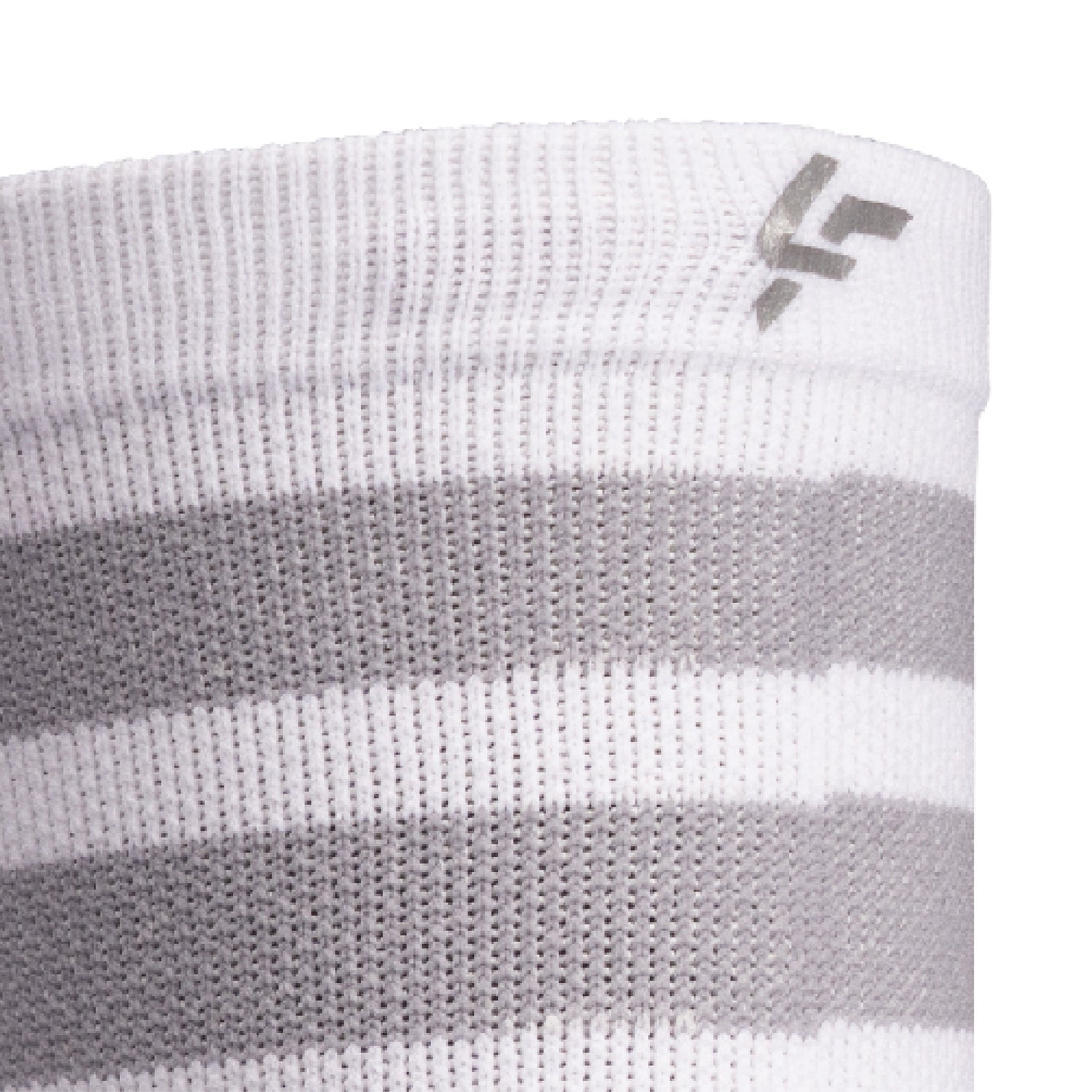 Close up view of reflective print symbol on Lightfeet Performance 2 Stripes White Half Crew Sock