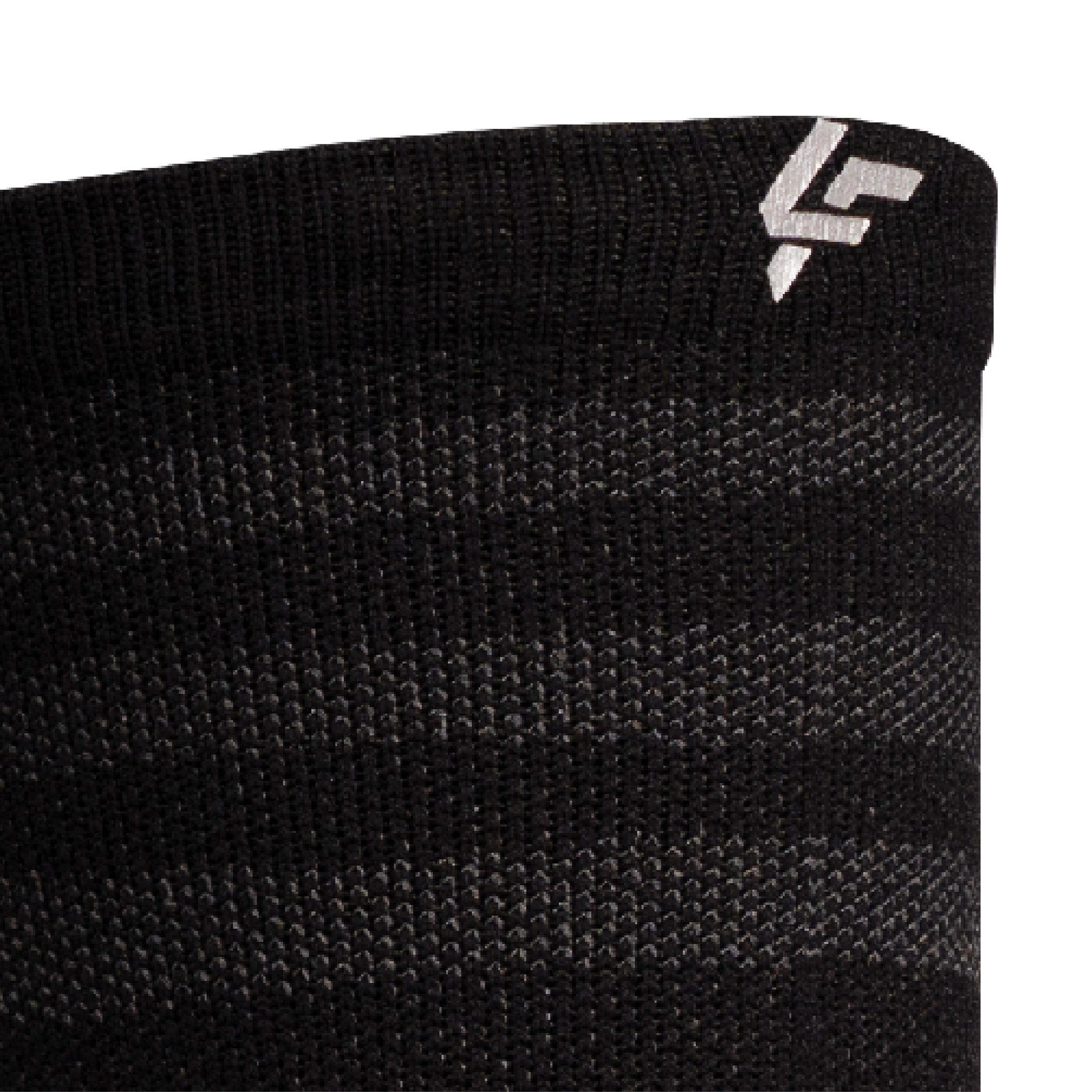 Close up view of reflective print symbol on Lightfeet Performance Raster Black Half Crew Sock