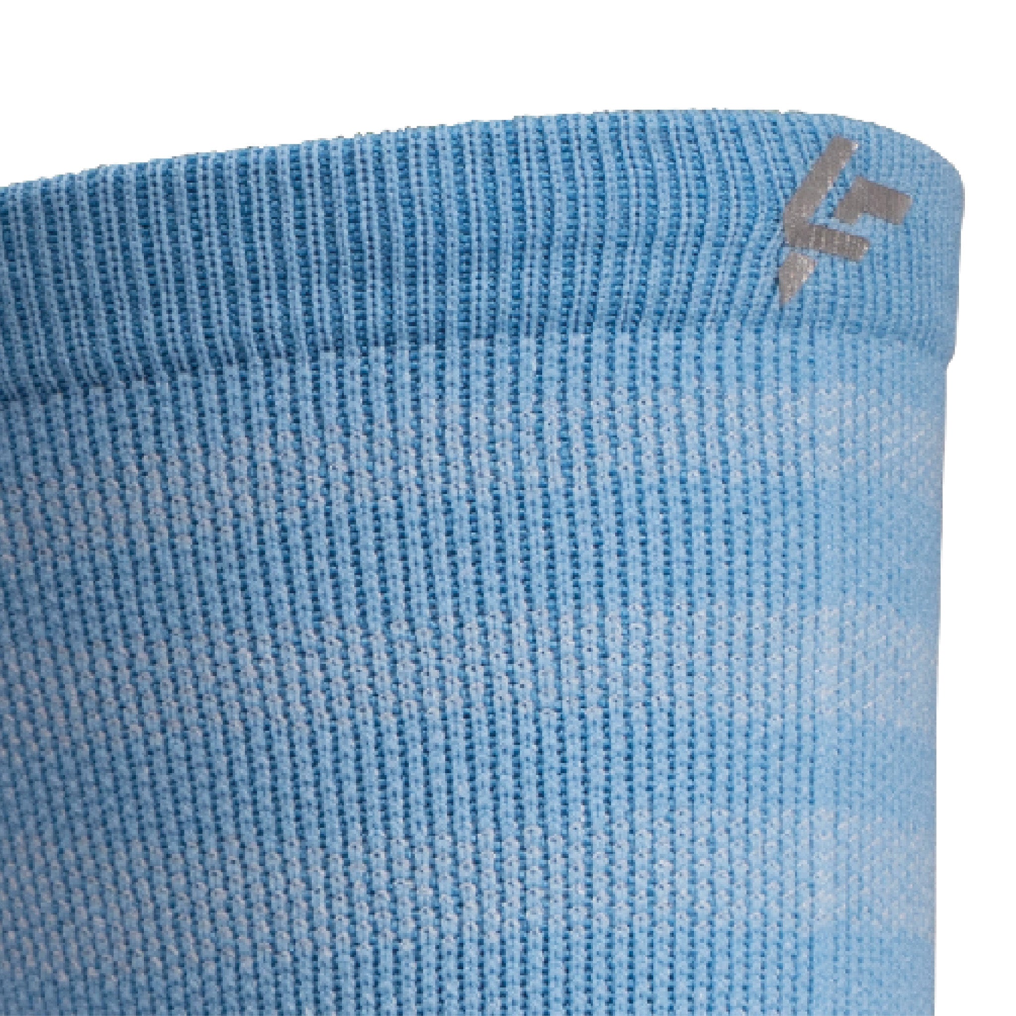 Close up view of reflective print symbol on Lightfeet Performance Raster Soft Blue Half Crew Sock