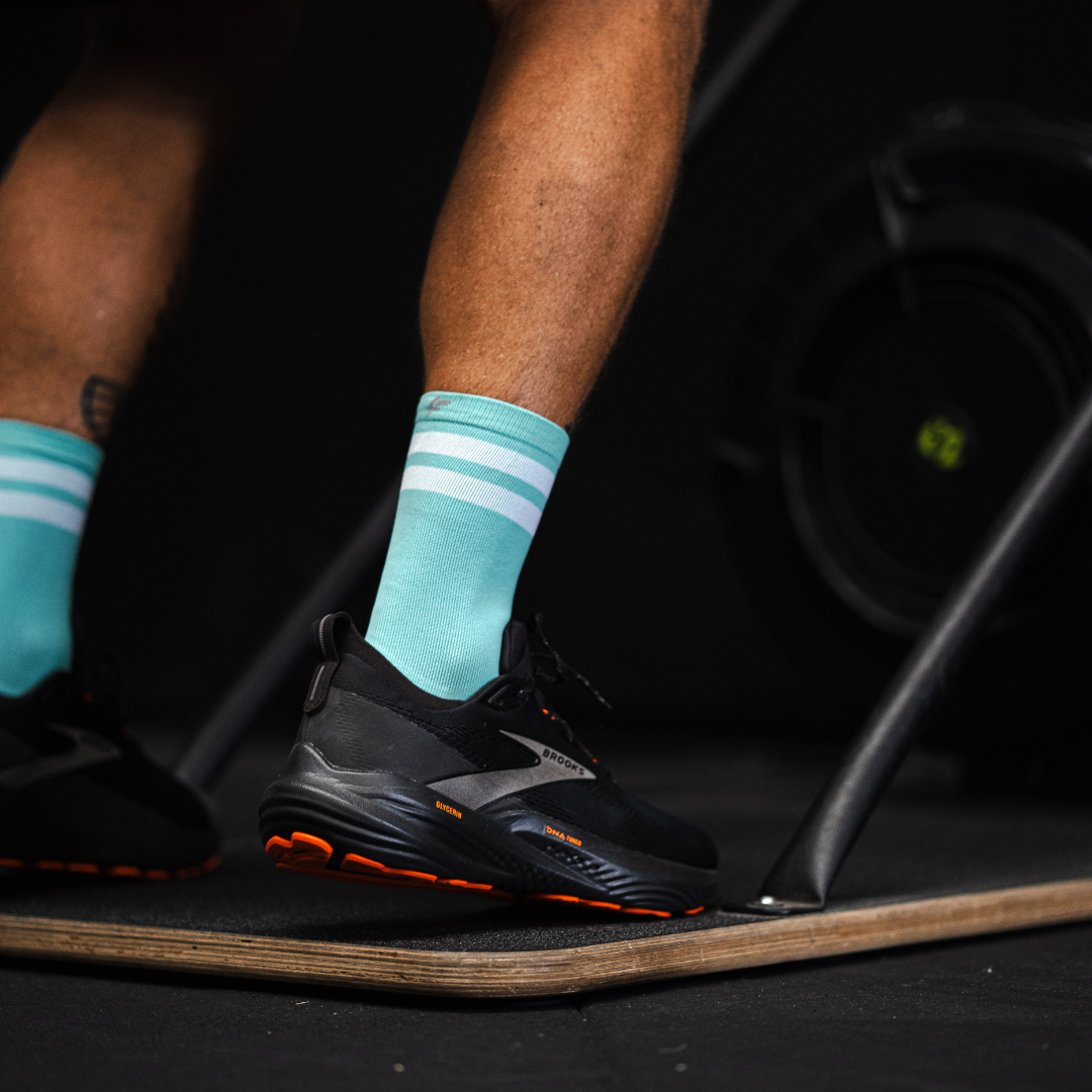 Image of person wearing Lightfeet Performance 2 Stripes Mint Half Crew Socks