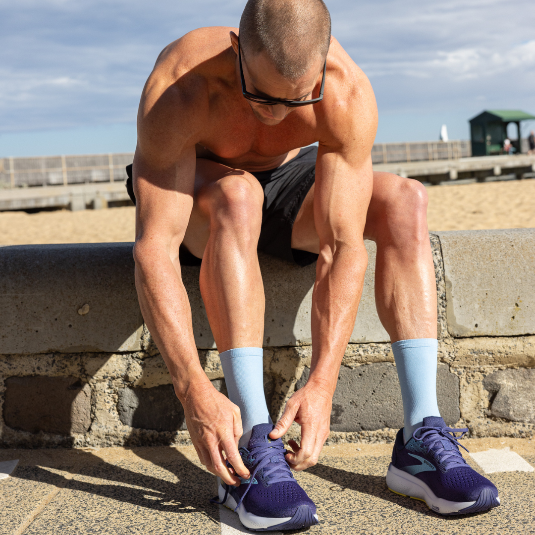 Person wearing Lightfeet Performance Soft Blue Half Crew Sock
