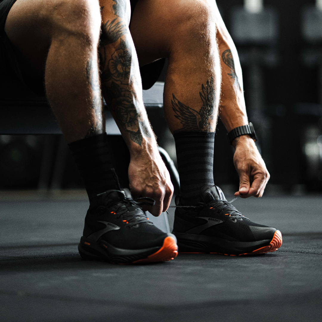 Image of person wearing Lightfeet Performance Raster Black Half Crew Socks