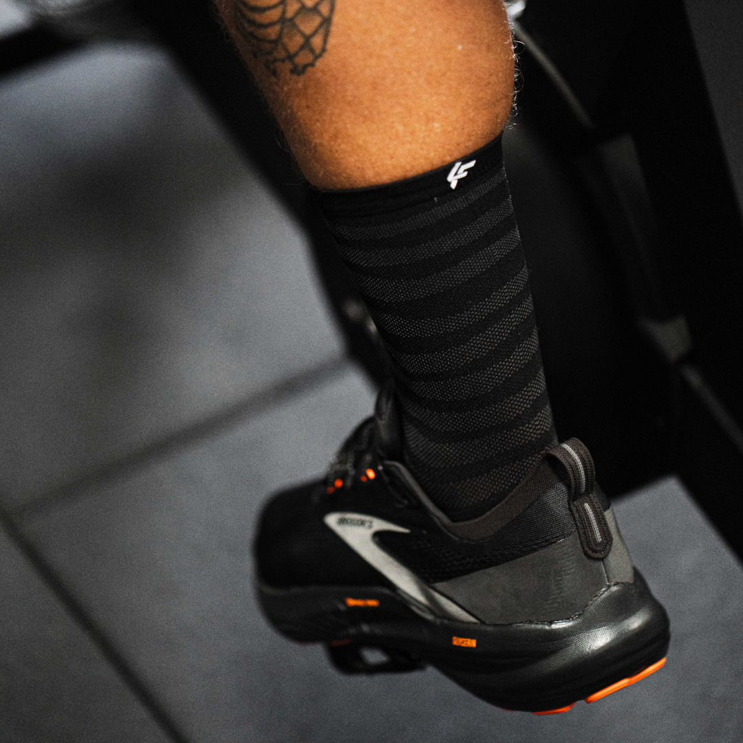 Image of person wearing Lightfeet Performance Raster Black Half Crew Socks