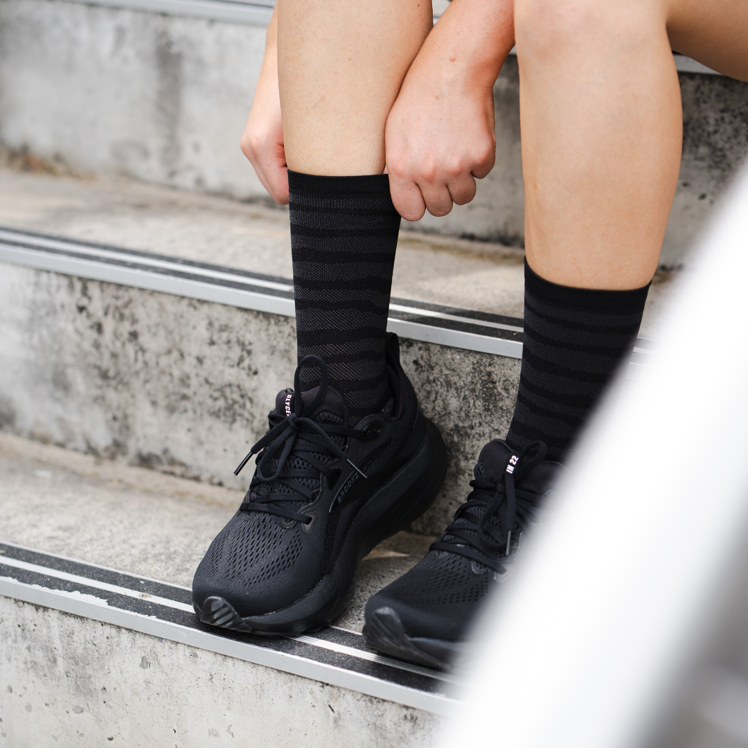 Image of person wearing Lightfeet Performance Raster Black Half Crew Socks