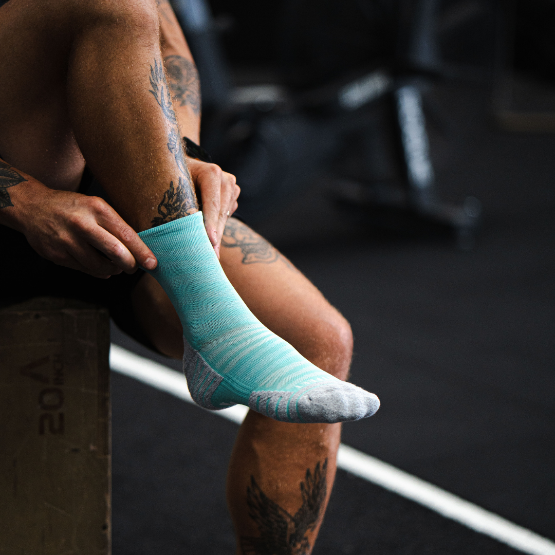 Image of person wearing Lightfeet Performance Raster Mint Half Crew Socks