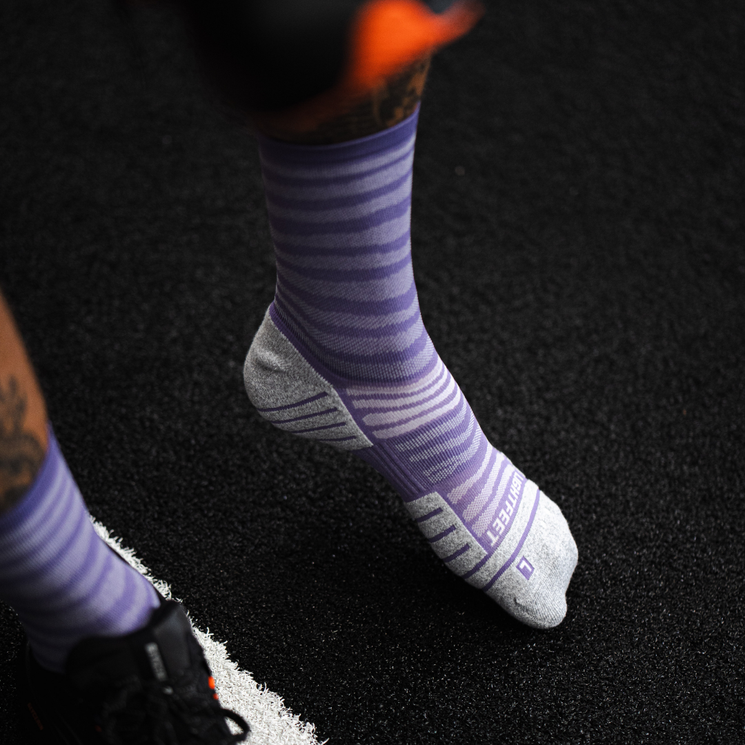 Image of person wearing Lightfeet Performance Raster Violet Half Crew Socks