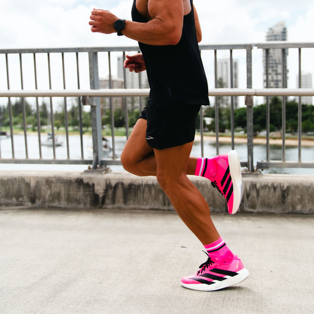 Image of person wearing Lightfeet Performance 2 Stripes Pink White BlackQuarter Socks 