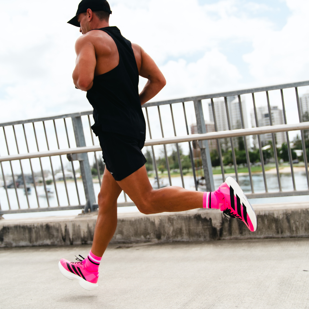 Image of person wearing Lightfeet Performance 2 Stripes Pink White BlackQuarter Socks 