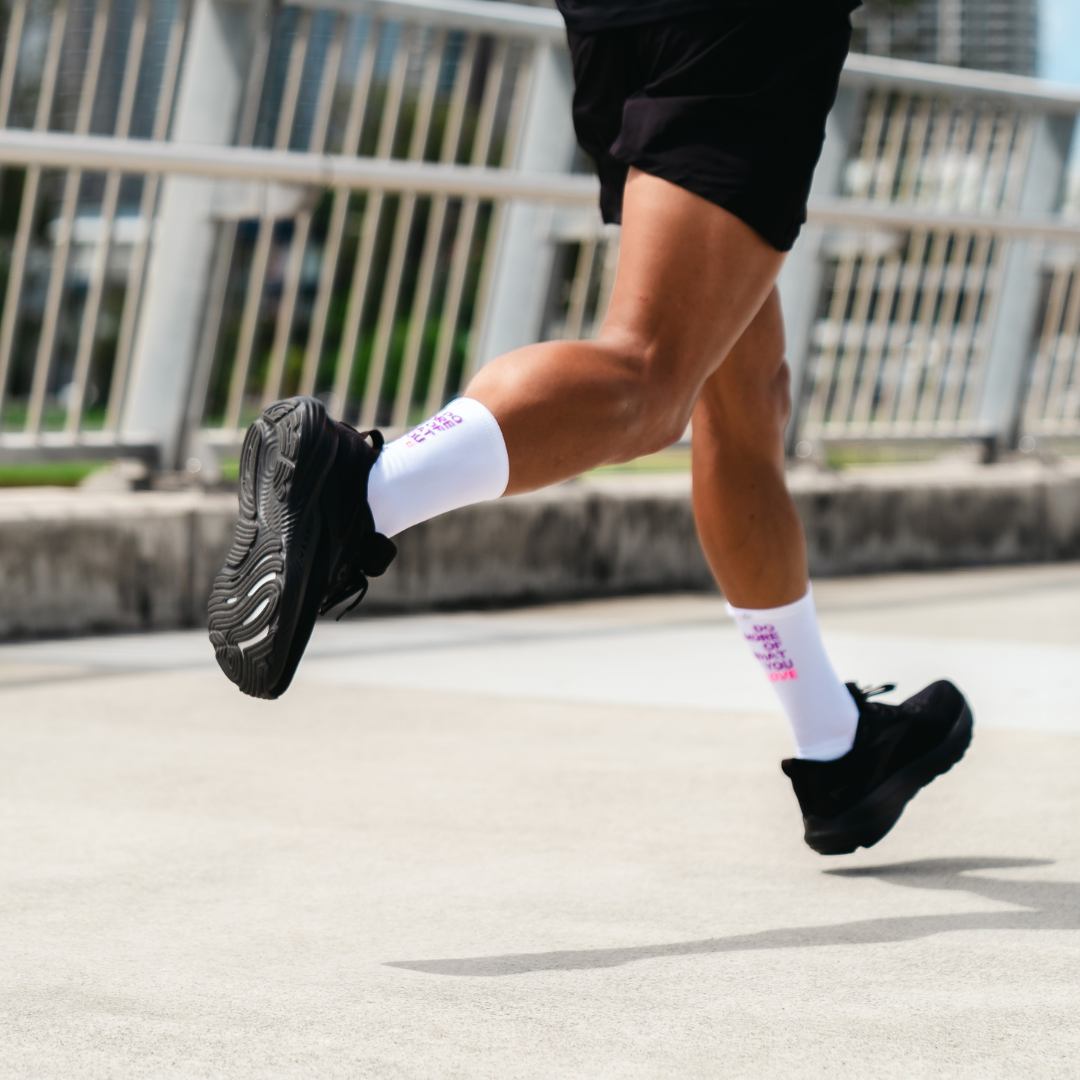 Image of person wearing Lightfeet Performance Do More Of What You Love White Purple Pink Crew Socks 