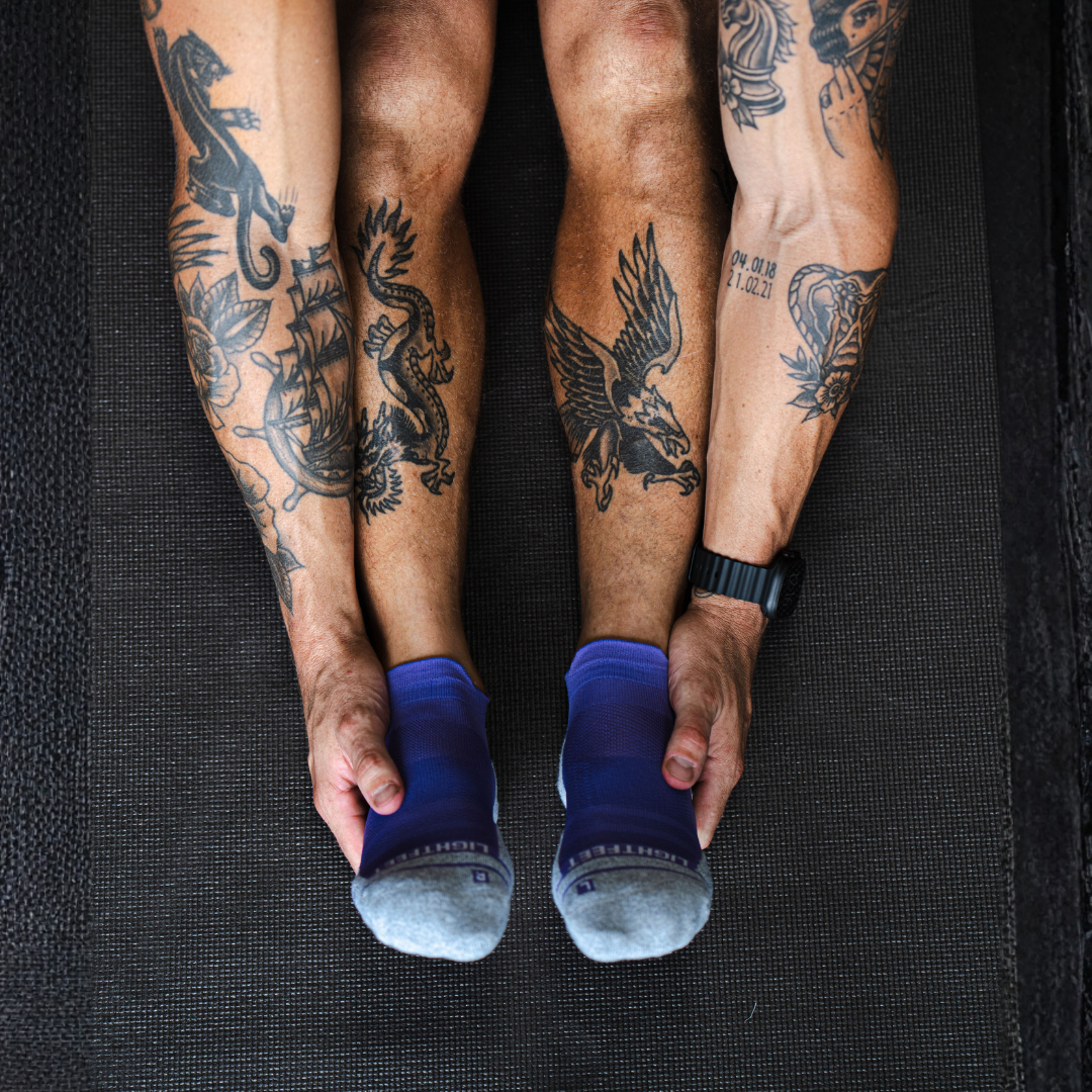 Person wearing Lightfeet Performance Violet Ankle Sock 