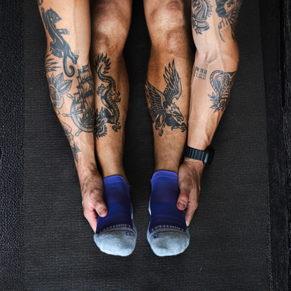 Person wearing Lightfeet Performance Violet Ankle Sock 