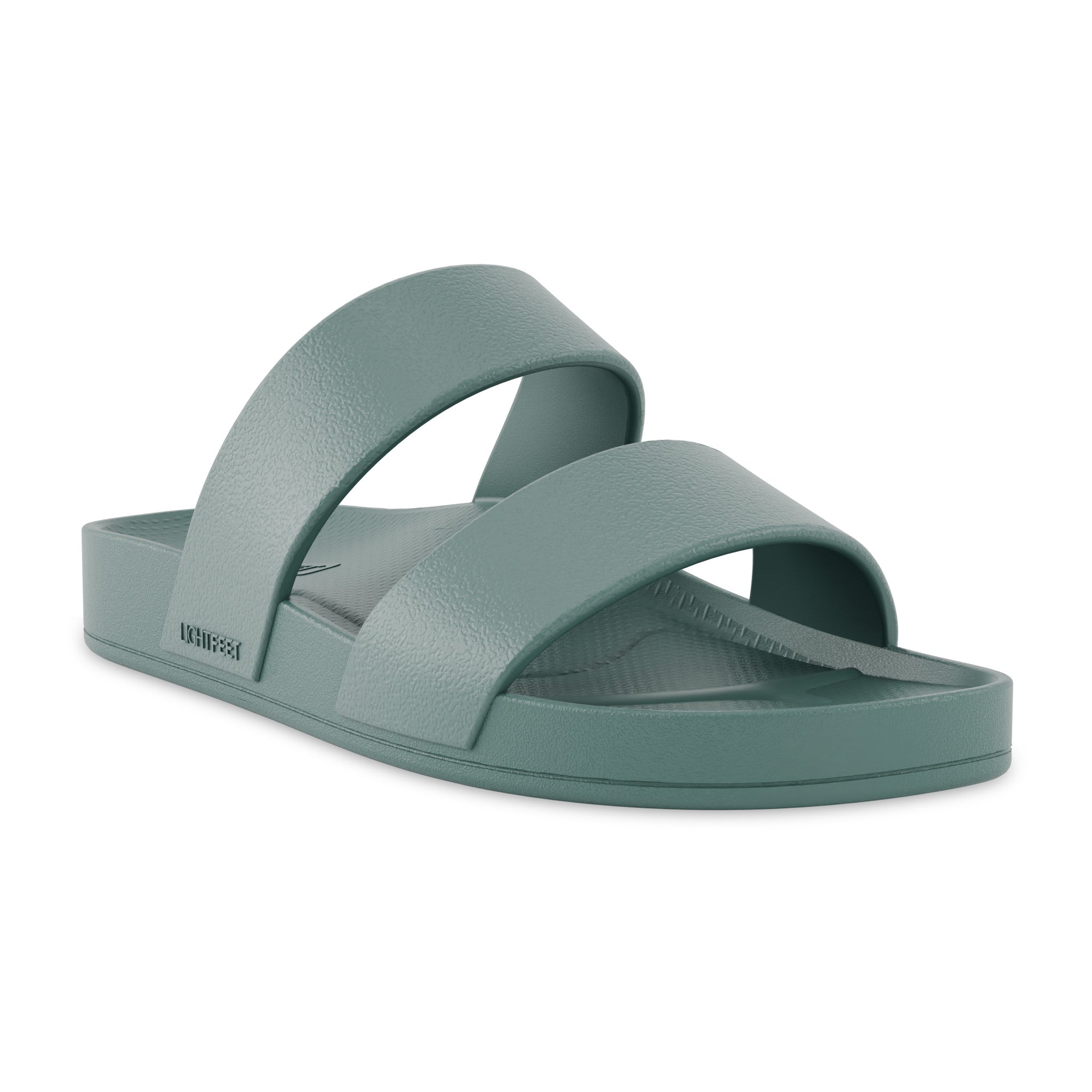 Green sandal with two straps on a white background