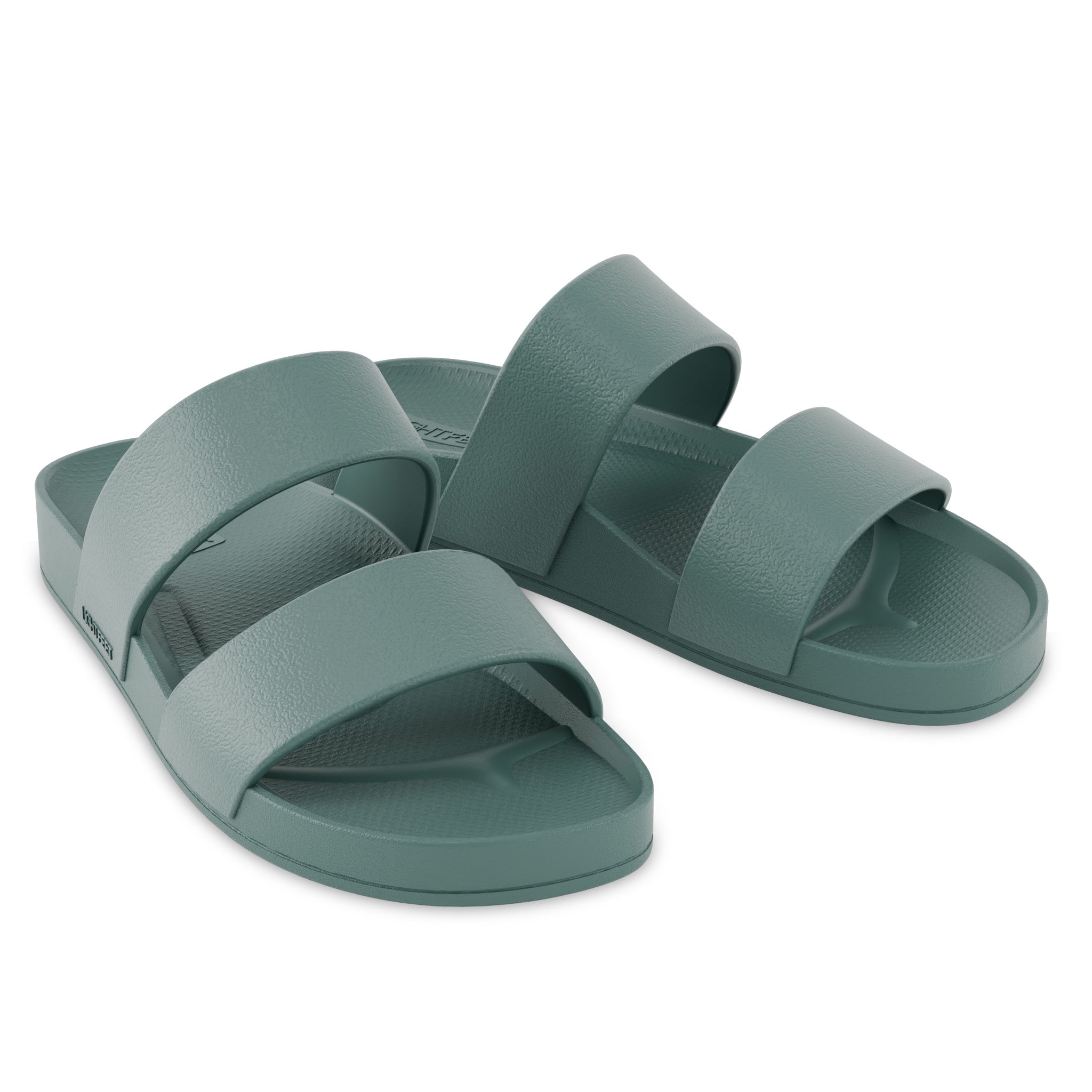 Pair of green sandals on a white background