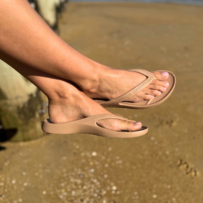 Person wearing Latte Lightfeet Arch Support Thongs