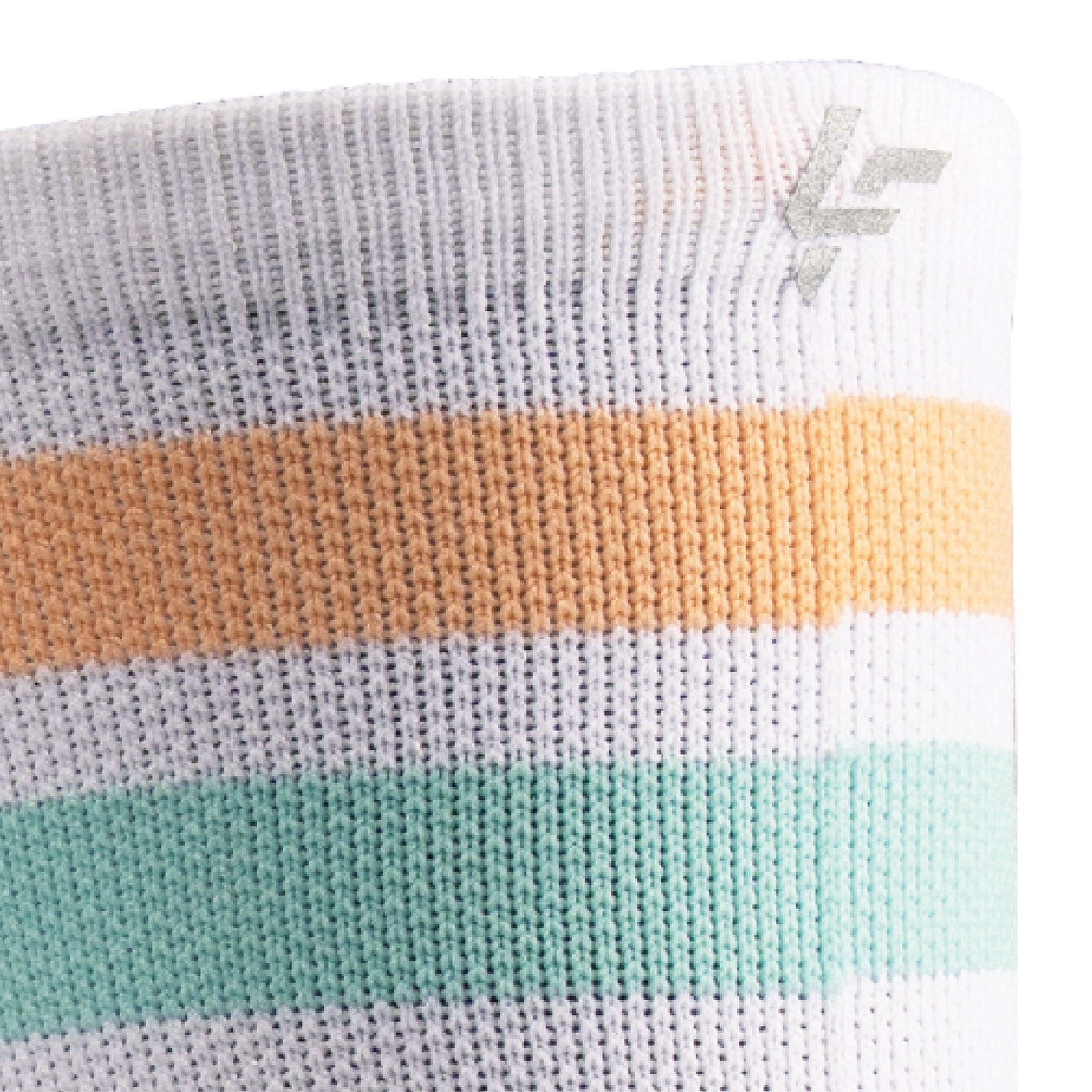 Close up view of reflective print symbol on Lightfeet Performance 2 Stripes White Coral Glacier Crew Socks 
