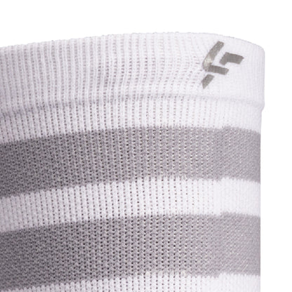 Close up view of reflective print symbol on Lightfeet Performance 2 Stripes White Half Crew Sock 