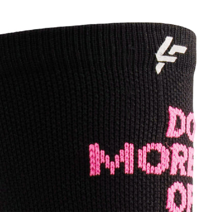 Close up view of reflective print symbol on Lightfeet Performance Do More Of What You Love Black Pink White Crew Socks 