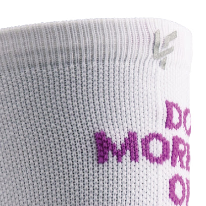 Close up view of reflective print symbol on Lightfeet Performance Do More Of What You Love White Purple Pink Crew Socks 