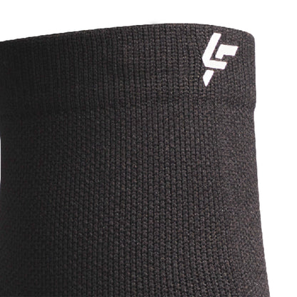 Close up view of reflective symbol on Lightfeet Performance Black Quarter Crew Sock 