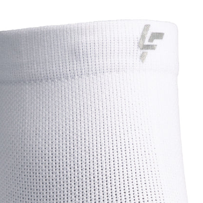 Close up view of reflective symbol on Lightfeet Performance White Quarter Crew Sock 
