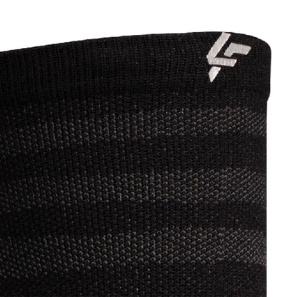 Close up view of reflective print symbol on Lightfeet Performance Raster Black Half Crew Sock 