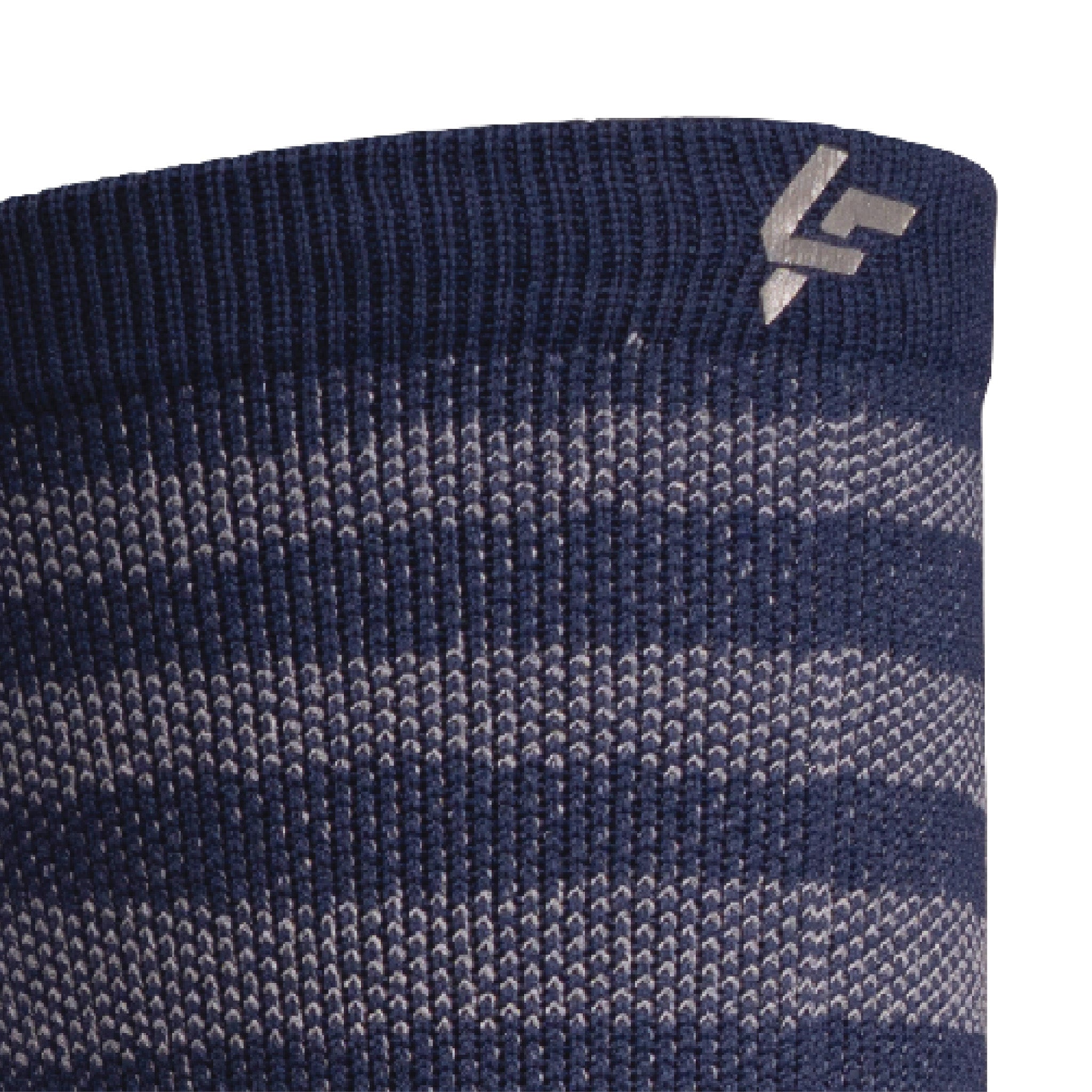 Close up view of reflective print symbol on Lightfeet Performance Raster Navy Half Crew Sock 
