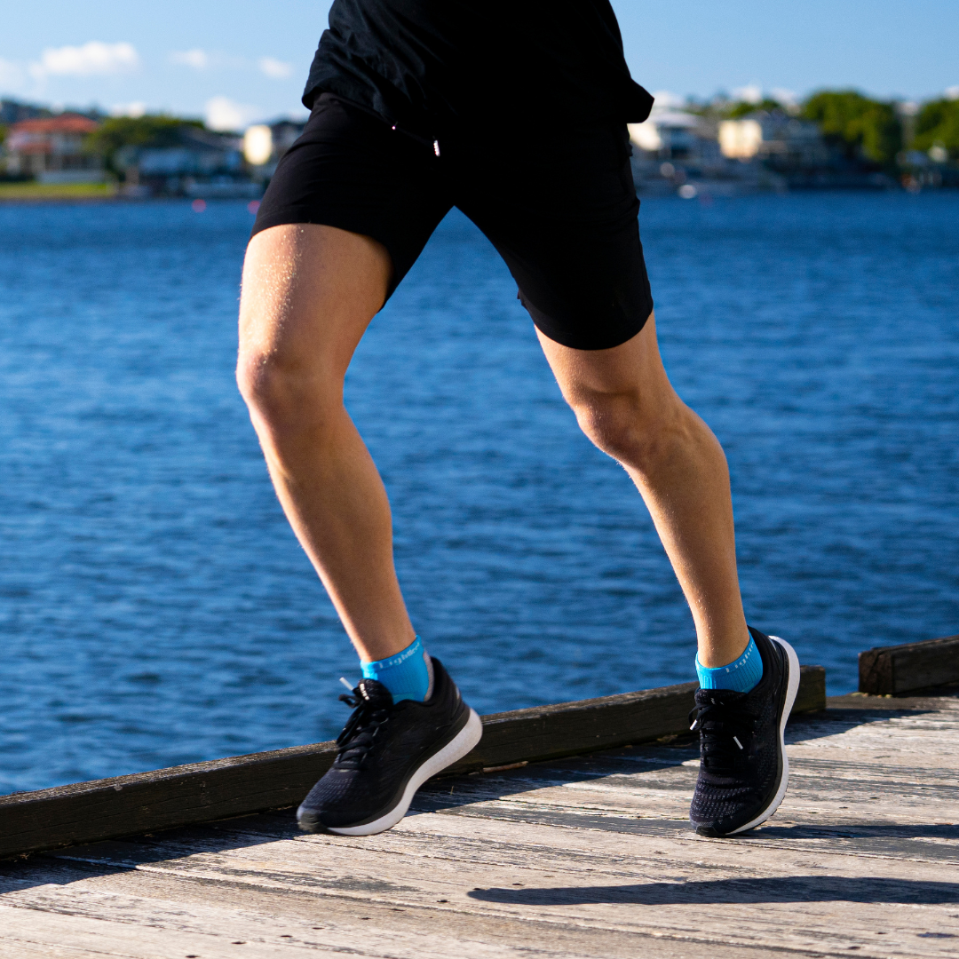 Person wearing Lightfeet Evolution Aqua Mini Crew Socks 
