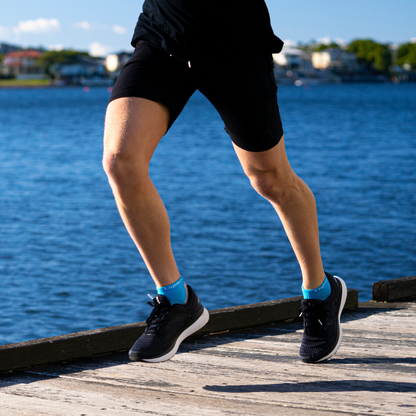 Person wearing Lightfeet Evolution Aqua Mini Crew Socks 