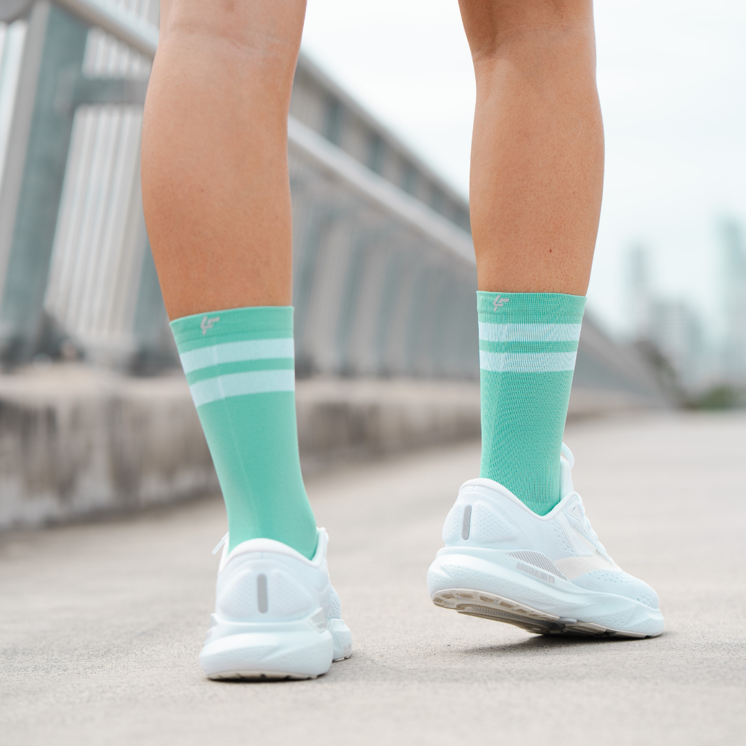 Image of person wearing Lightfeet Performance 2 Stripes Mint Half Crew Socks 