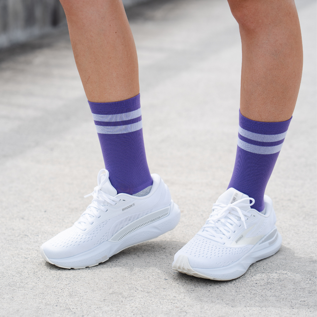 Image of person wearing Lightfeet Performance 2 Stripes Violet Half Crew Socks 