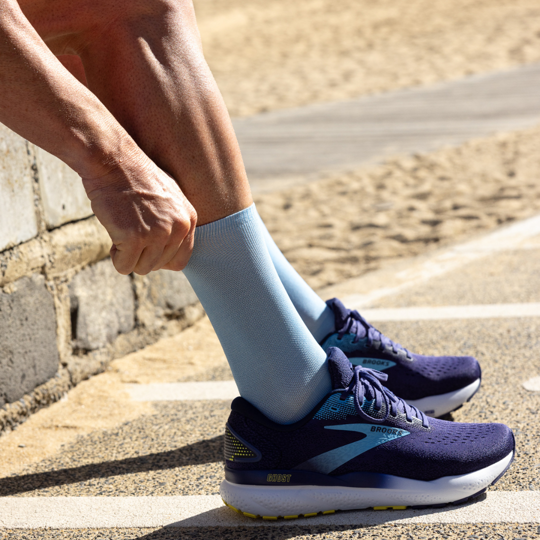 Person wearing Lightfeet Performance Soft Blue Half Crew Sock 