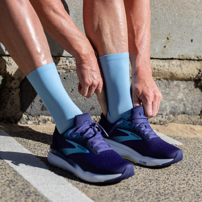 Person wearing Lightfeet Performance Soft Blue Half Crew Sock 